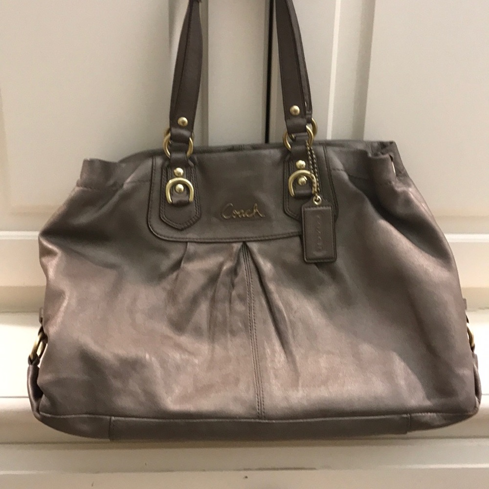 Beautiful Coach tote. Looks great with any color.